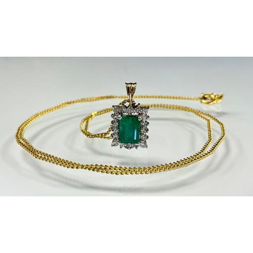 290 - An emerald and diamond pendant necklace, central rectangular cut emerald approx 0.90ct, surrounded b... 