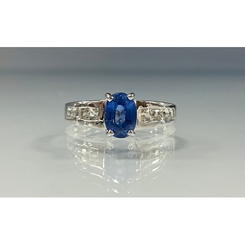 168 - A certified kyanite and white stone ring, oval mixed cut kyanite 0.95ct, claw set above white stone ... 