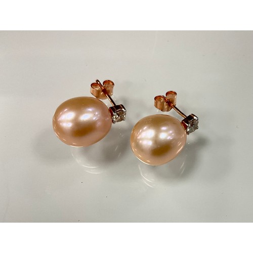 226 - A pair of diamond and peach coloured cultured pearl rose gold earrings, total diamond weight 0.26ct,... 