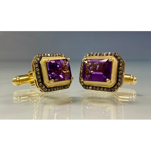 224 - A pair of amethyst and diamond cufflinks, central rectangular emerald cut amethyst, above cream enam... 