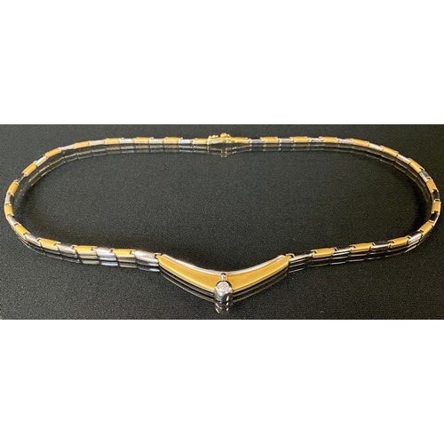 160 - A 14ct gold two tone yellow and white gold fancy link necklace, set with a single round brilliant cu... 