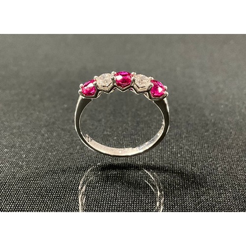 245 - A ruby and diamond ring, alternate set with three red rubies and two round brilliant cut diamonds, t... 