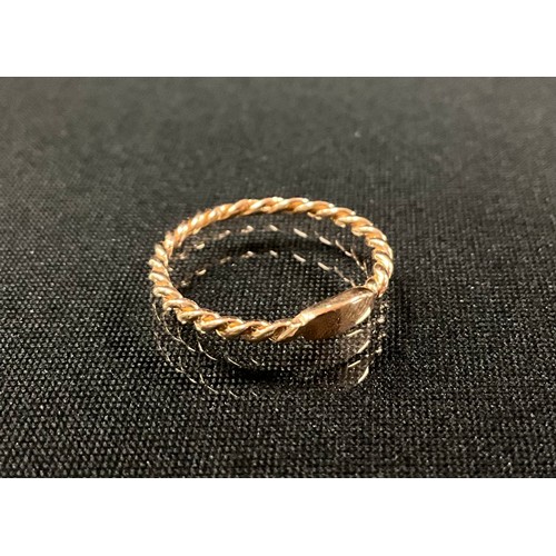 267 - An 18ct rose gold twisted shank stacking ring, size L, 1.6g gross.