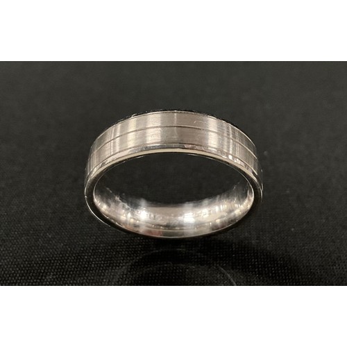 293 - An engraved satin platinum wedding band, 6mm wide, size T, 7.9g