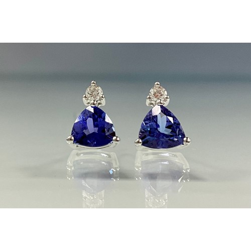 234 - A pair of trilliant cut tanzanite and diamond stud earrings, total estimated stone weights, tanzanit... 