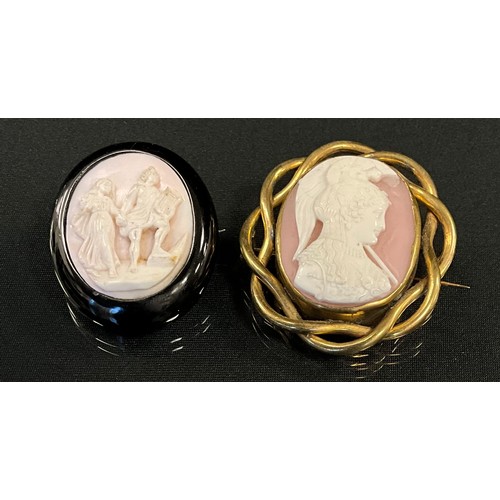 262 - A Victorian pink and white shell cameo brooch, bust portrait to dexter, wearing a plumed helm, long ... 