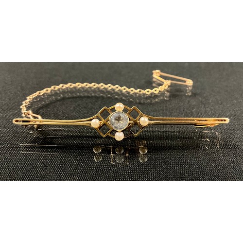 278 - An Edwardian 15ct gold aquamarine and seed pearl bar brooch, central circular pale blue aquamarine, ... 