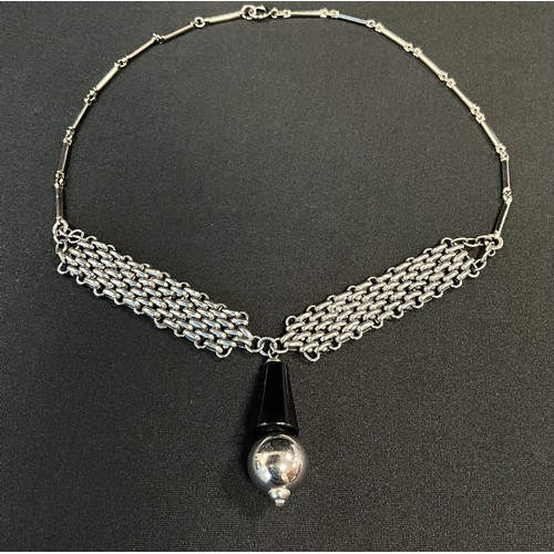 213 - A Jacob Bengel black galalith and chain mail panel link necklace, the front mesh section suspending ... 