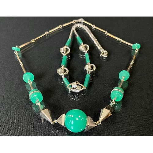 300 - Jakob Bengel, a 1930s German Bauhaus Galalith and emerald glass necklace with ring and globular bead... 