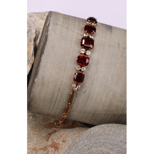 261 - A Victorian paste garnet and diamond effect bracelet, unmarked yellow metal mount and bracelet, 16.5... 