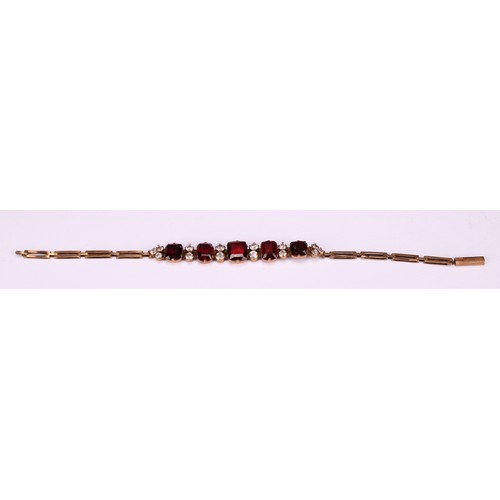 261 - A Victorian paste garnet and diamond effect bracelet, unmarked yellow metal mount and bracelet, 16.5... 