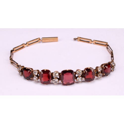 261 - A Victorian paste garnet and diamond effect bracelet, unmarked yellow metal mount and bracelet, 16.5... 