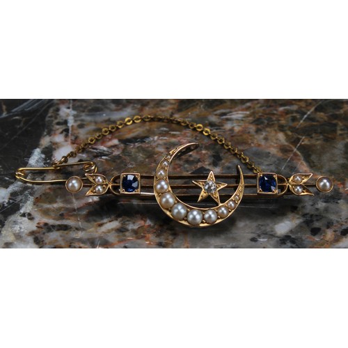 283 - An Edwardian diamond, sapphire, seed pearl and yellow gold coloured metal brooch, centred by a cresc... 