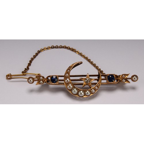 283 - An Edwardian diamond, sapphire, seed pearl and yellow gold coloured metal brooch, centred by a cresc... 