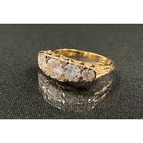 199 - A diamond ring, set with five graduated round brilliant cut diamonds, largest approx 5.4mm x 3.2mm, ... 