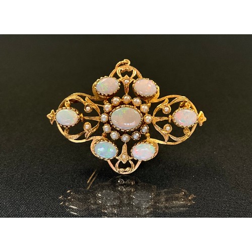 295 - An opal and seed pearl pendant brooch, scrolling mount set with seven oval opals and eighteen seed p... 