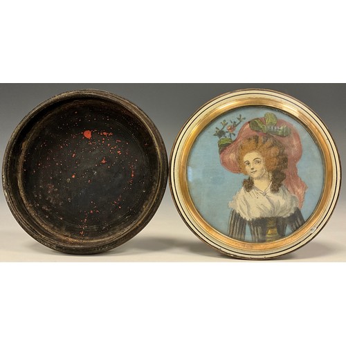 620 - An early 19th century circular snuff box, with hand coloured engraving of a lady to cover, the rear ... 