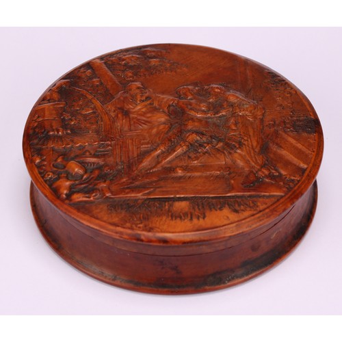 647 - Snuff - A 19th circular century pressed walnut tortoiseshell lined snuff box, the cover decorated wi... 