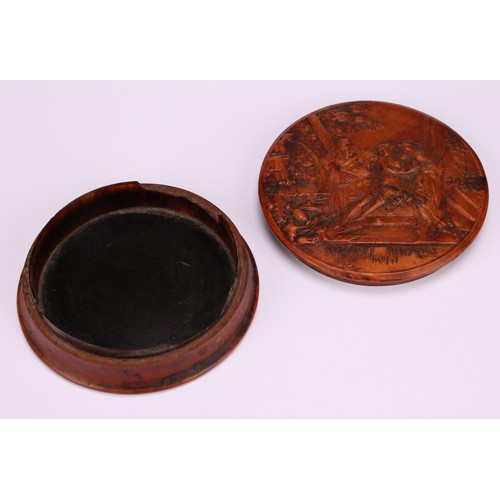 647 - Snuff - A 19th circular century pressed walnut tortoiseshell lined snuff box, the cover decorated wi... 