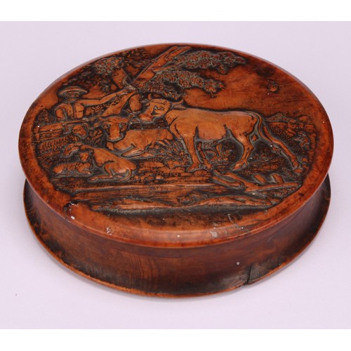 623 - Snuff - A 19th century circular pressed walnut snuff box, the cover decorated with a farmer, cattle ... 