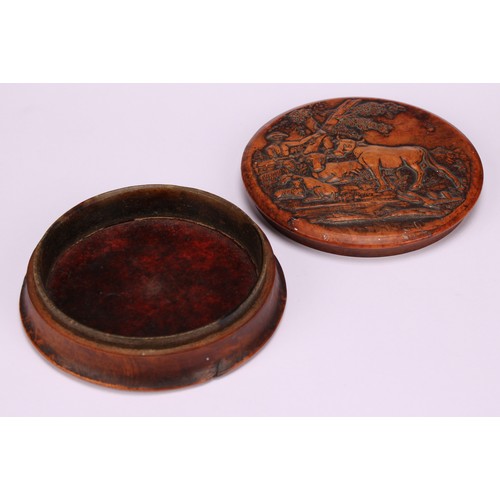 623 - Snuff - A 19th century circular pressed walnut snuff box, the cover decorated with a farmer, cattle ... 