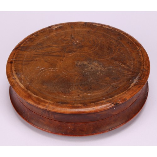 623 - Snuff - A 19th century circular pressed walnut snuff box, the cover decorated with a farmer, cattle ... 