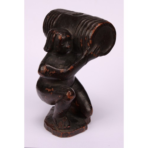 641 - Snuff - a 19th century novelty treen snuff box, carved as the pooping man, squatting holding a barre... 