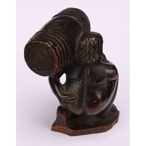 641 - Snuff - a 19th century novelty treen snuff box, carved as the pooping man, squatting holding a barre... 