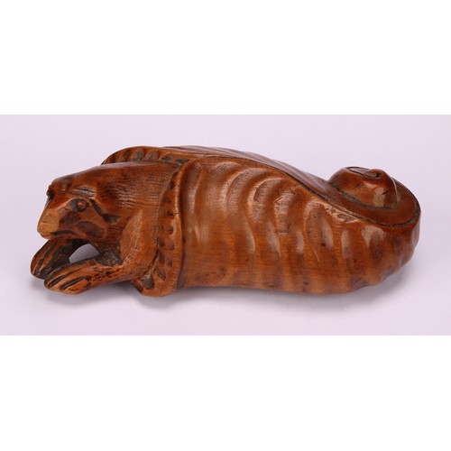 633 - Snuff - a 19th century novelty boxwood snuff box, carved with a bizarre creature emerging from a cur... 