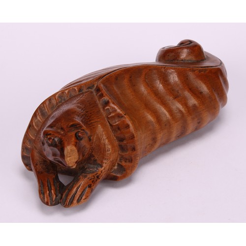 633 - Snuff - a 19th century novelty boxwood snuff box, carved with a bizarre creature emerging from a cur... 