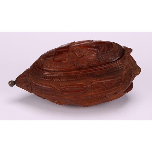 626 - Snuff - a 19th century coquilla nut bugbear snuff box, carved with baskets of fruit, swags and tendr... 