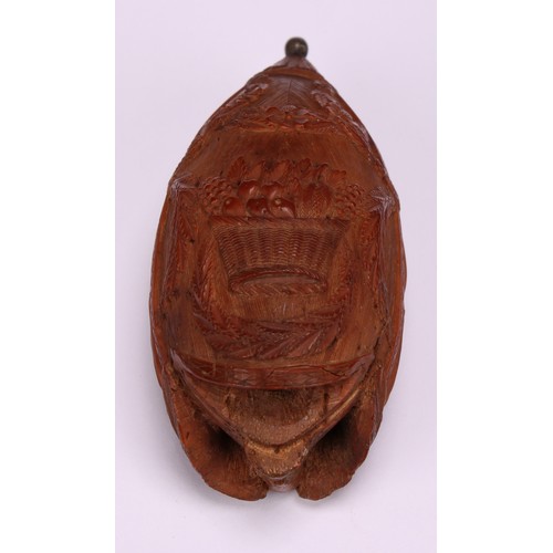 626 - Snuff - a 19th century coquilla nut bugbear snuff box, carved with baskets of fruit, swags and tendr... 