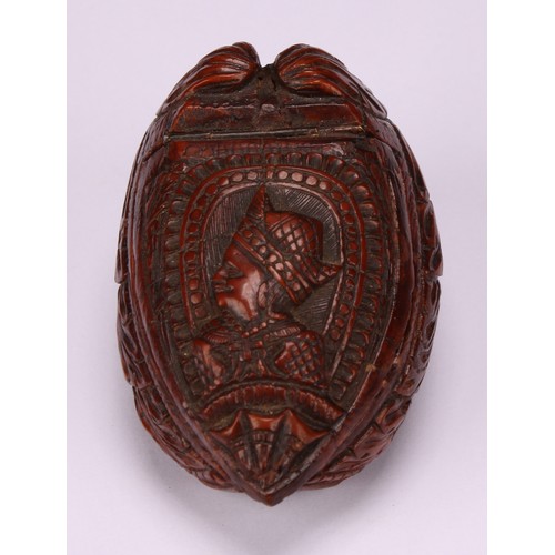 625 - Snuff - a 19th century coquilla nut bugbear snuff box, carved as a novelty shoe, the cover carved wi... 