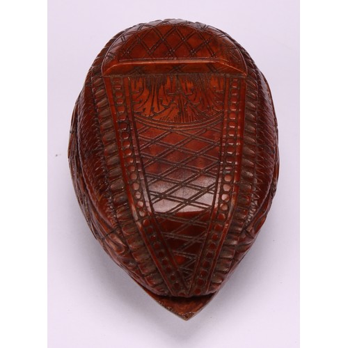 625 - Snuff - a 19th century coquilla nut bugbear snuff box, carved as a novelty shoe, the cover carved wi... 