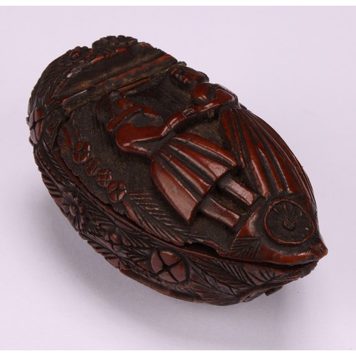 627 - Snuff - a 19th century coquilla nut bugbear snuff box, carved with floral roundels and urns planted ... 