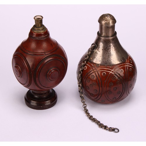 628 - Snuff - a 19th century coquilla nut snuff flask of squared spherical form, the sides with turned rou... 