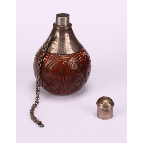 628 - Snuff - a 19th century coquilla nut snuff flask of squared spherical form, the sides with turned rou... 