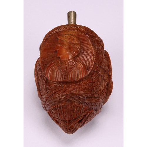 634 - Snuff - a 19th century novelty coquilla nut bugbear snuff flask, carved with oval portrait cameos wi... 