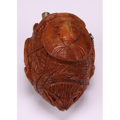 634 - Snuff - a 19th century novelty coquilla nut bugbear snuff flask, carved with oval portrait cameos wi... 