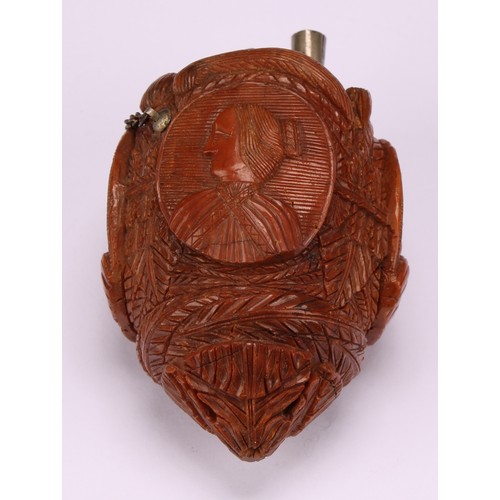 634 - Snuff - a 19th century novelty coquilla nut bugbear snuff flask, carved with oval portrait cameos wi... 