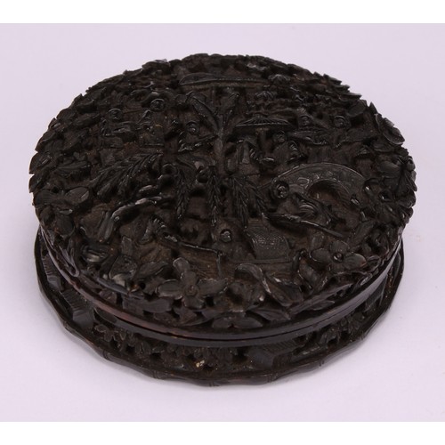 622 - Snuff - a 19th century Cantonese circular tortoiseshell snuff box, the whole finely carved with figu... 