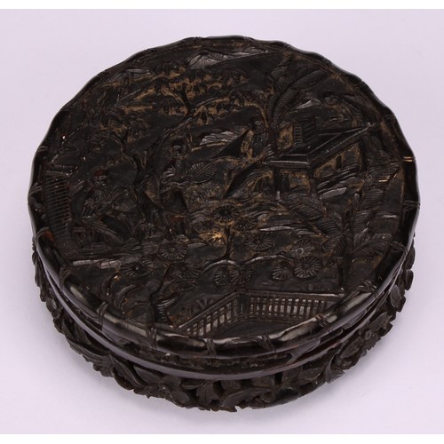 622 - Snuff - a 19th century Cantonese circular tortoiseshell snuff box, the whole finely carved with figu... 