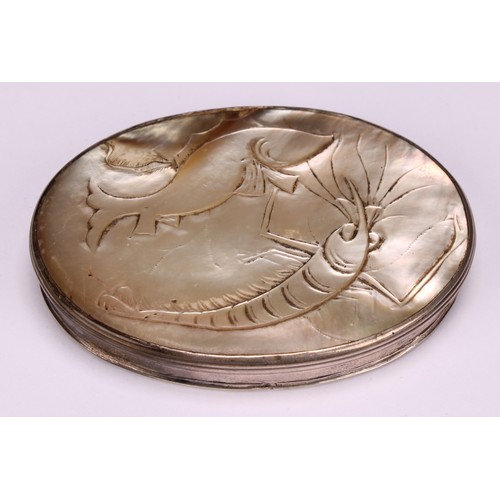 650 - Snuff - a George III oval mother of pearl snuff box, carved with a prawn and fish, silver coloured m... 