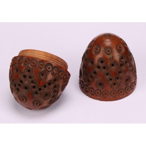 616 - A 19th century novelty coquilla nut nutmeg grater in the form of an acorn, turned cover, steel grill... 