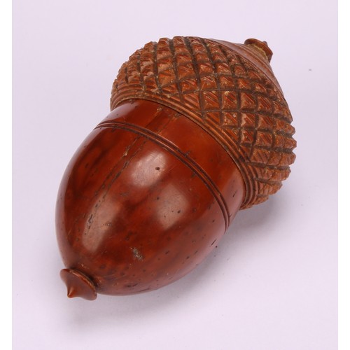 615 - A 19th century novelty coquilla nut nutmeg grater in the form of an acorn, steel grill, 7.5cm high, ... 