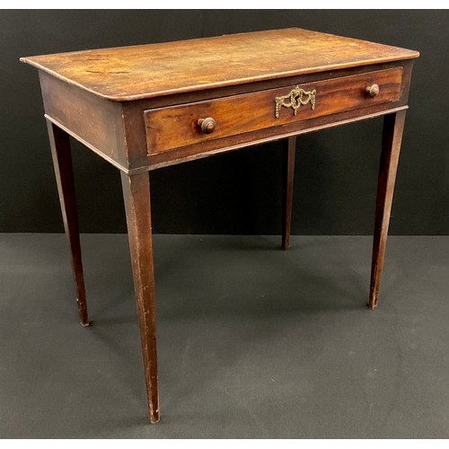 1216 - A George III small mahogany writing table, the rounded rectangular top above a single shallow drawer... 