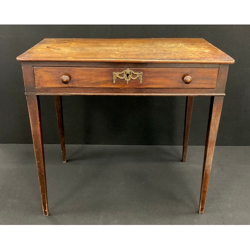 1216 - A George III small mahogany writing table, the rounded rectangular top above a single shallow drawer... 