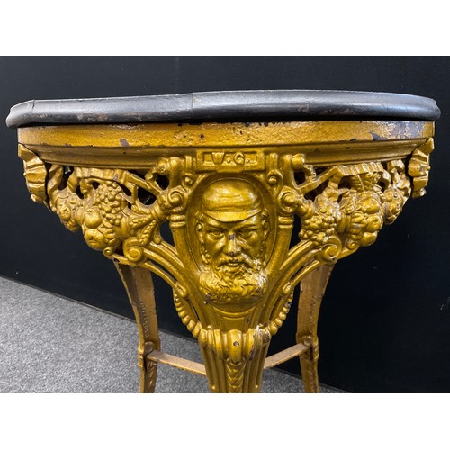 894 - A Victorian cast iron pub table, of cricket interest, the frieze cast with portraits of W G Grace, a... 