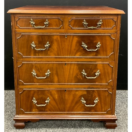 1039 - A George II revival mahogany chest of drawers, over-sailing flame mahogany top, above a pair of shor... 