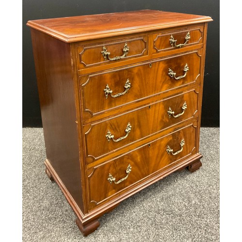 1039 - A George II revival mahogany chest of drawers, over-sailing flame mahogany top, above a pair of shor... 